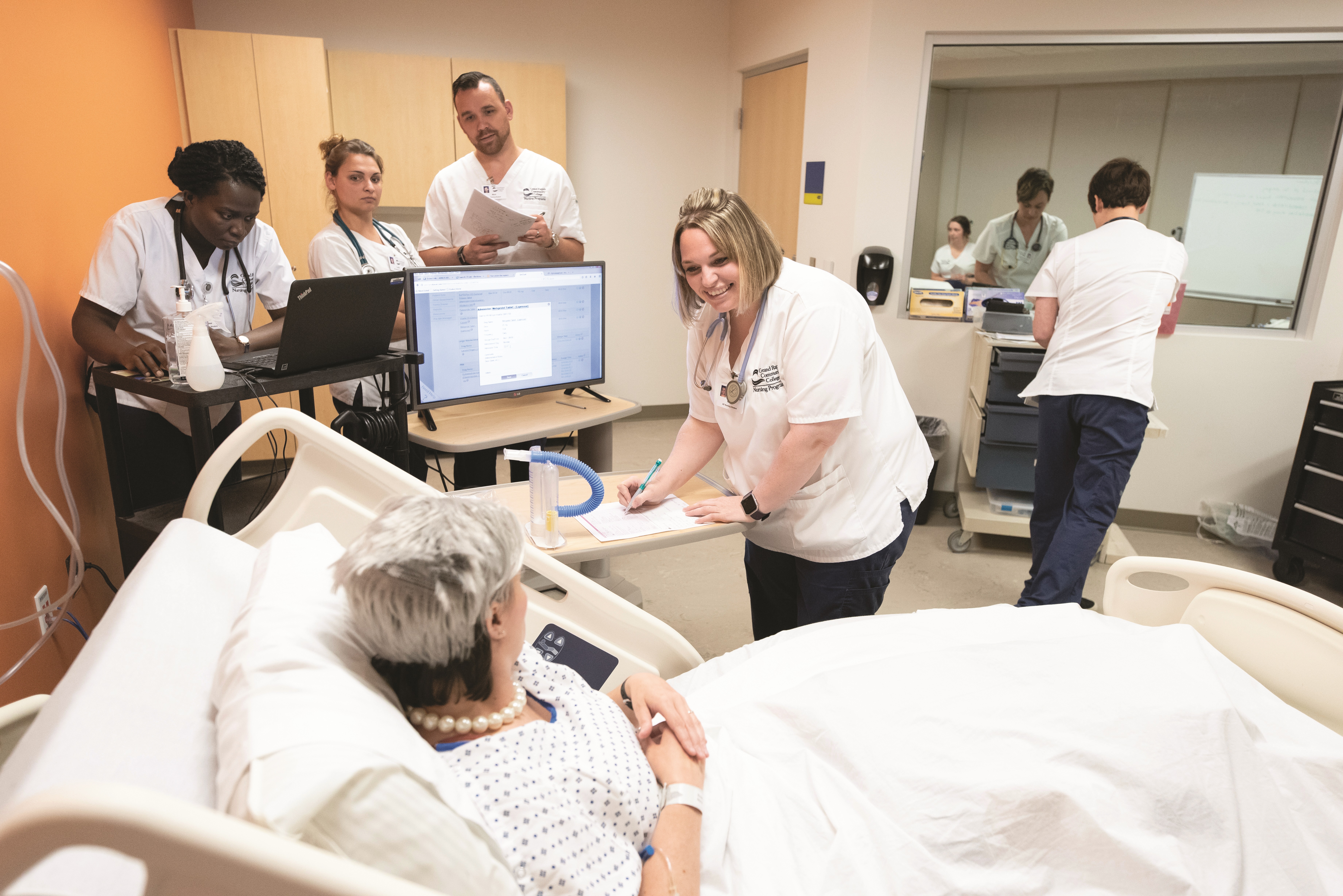 GRCC Nursing Students Working on a Patient in the CNA Lab