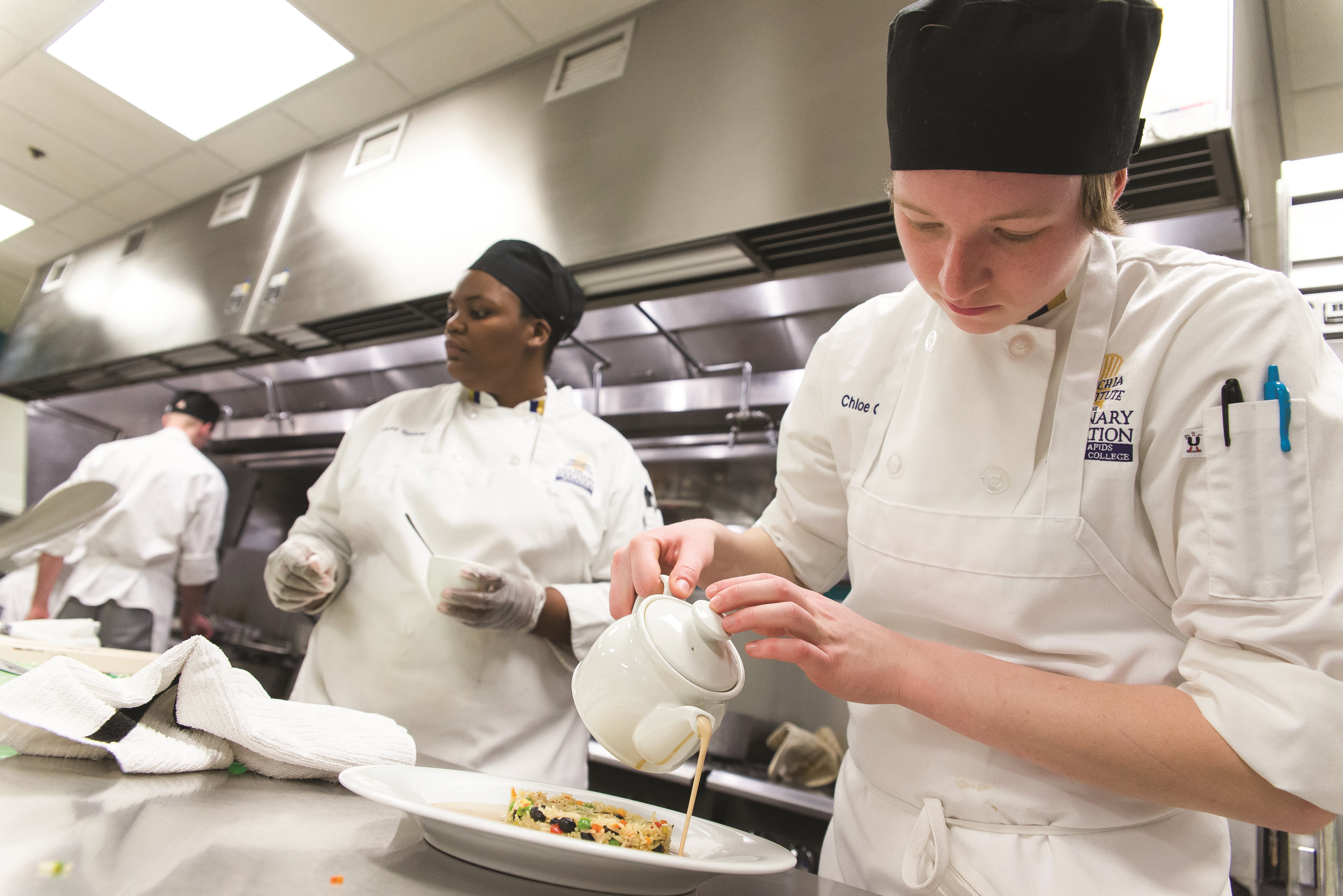GRCC Culinary Students finalizing a dinner in the Kitchen