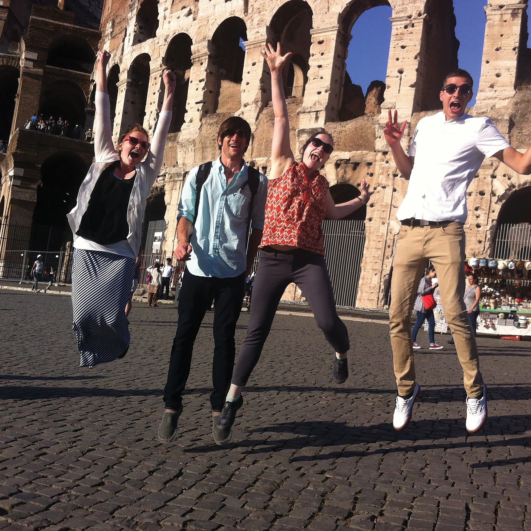 GRCC Students jumping in front of the Coliseum in Rome