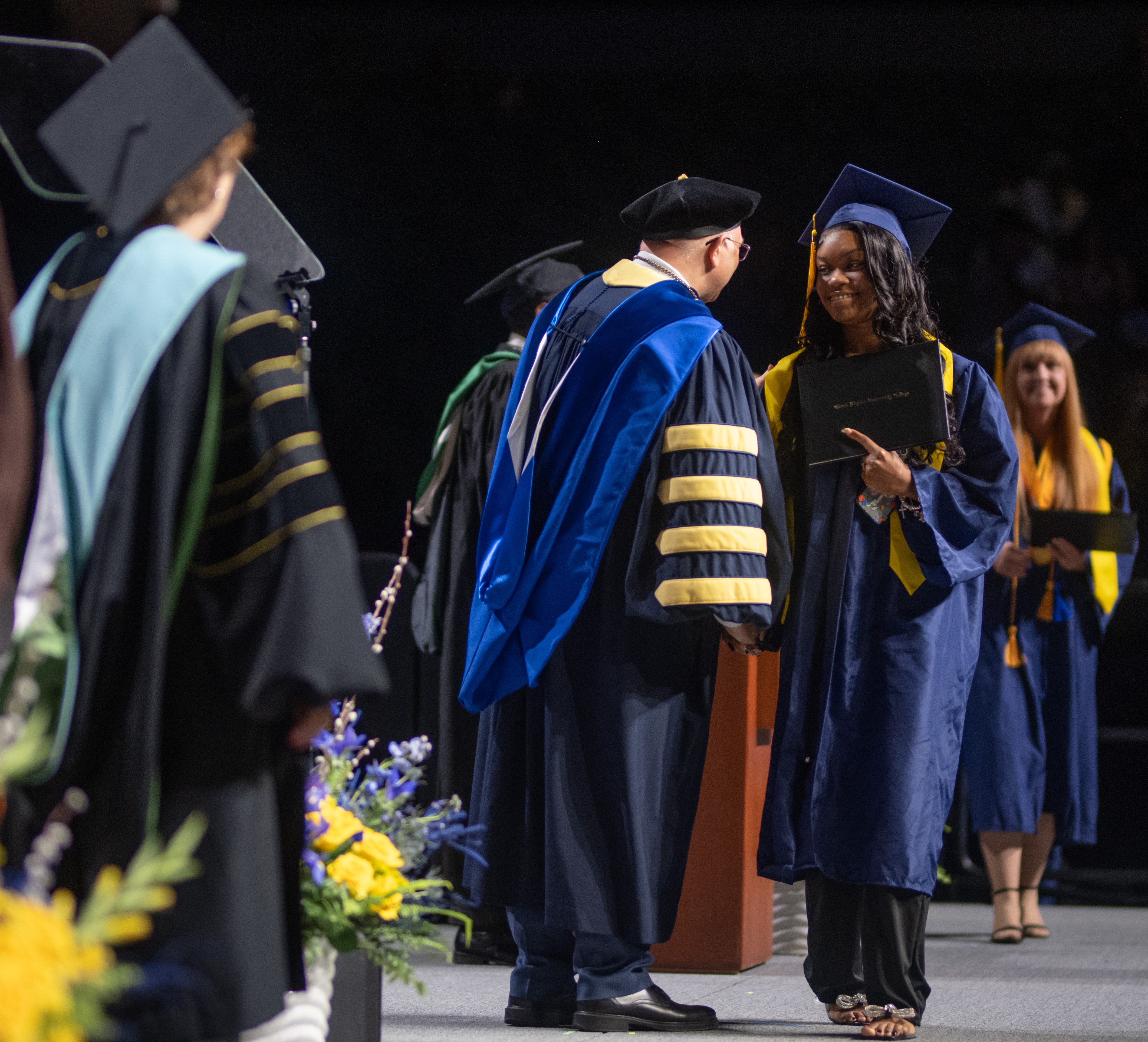 GRCC Graduate Receiving their Diploma from President Lepper