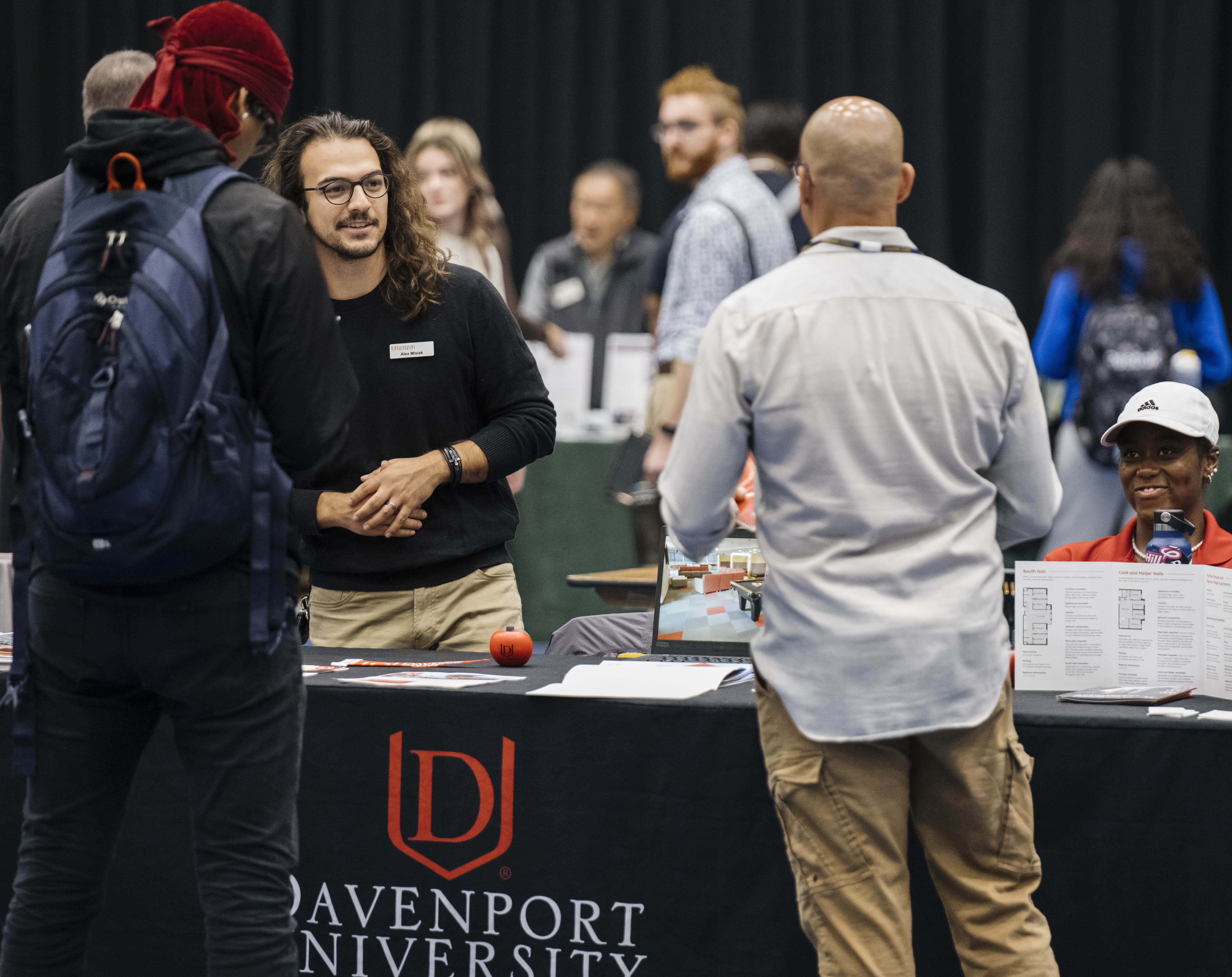 GRCC Students talking with Davenport Universty Rep at the Transfer Fair