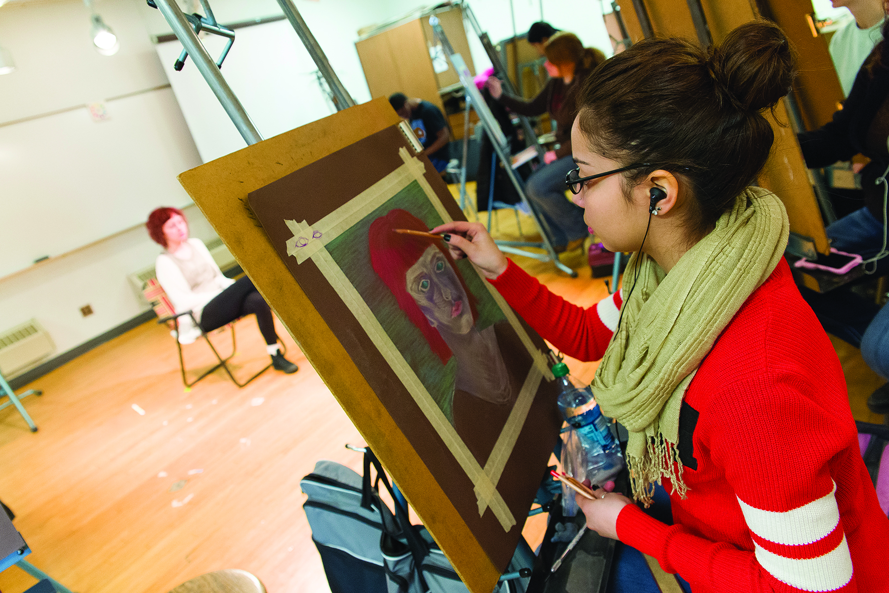 GRCC Art student working on a drawing in class